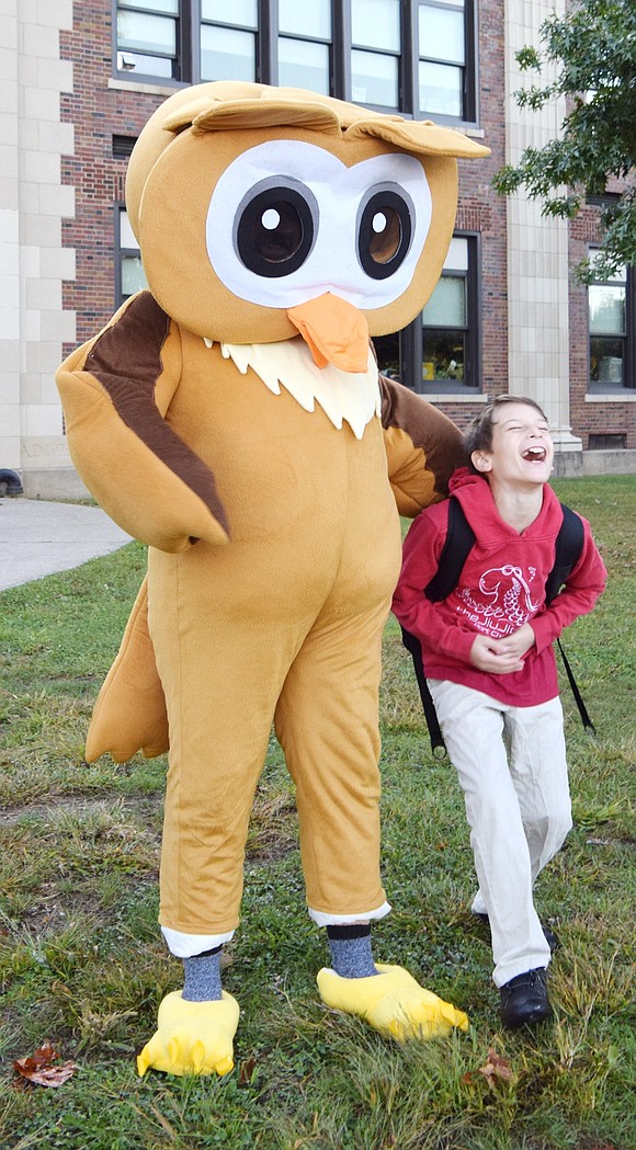 Park Avenue Elementary School fifth-grader Bradyn Tamucci, a 10-year-old who lives on Breckenridge Avenue, has a big laugh with Hoot (played by his dad, Michael).