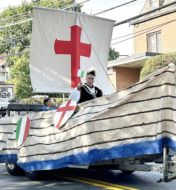 Christopher Columbus, played by Port Chester resident and former Knights of Columbus Grand Knight Nate Casterella, waves the Italian flag from a float representing the ships he used to cross the Atlantic Ocean.