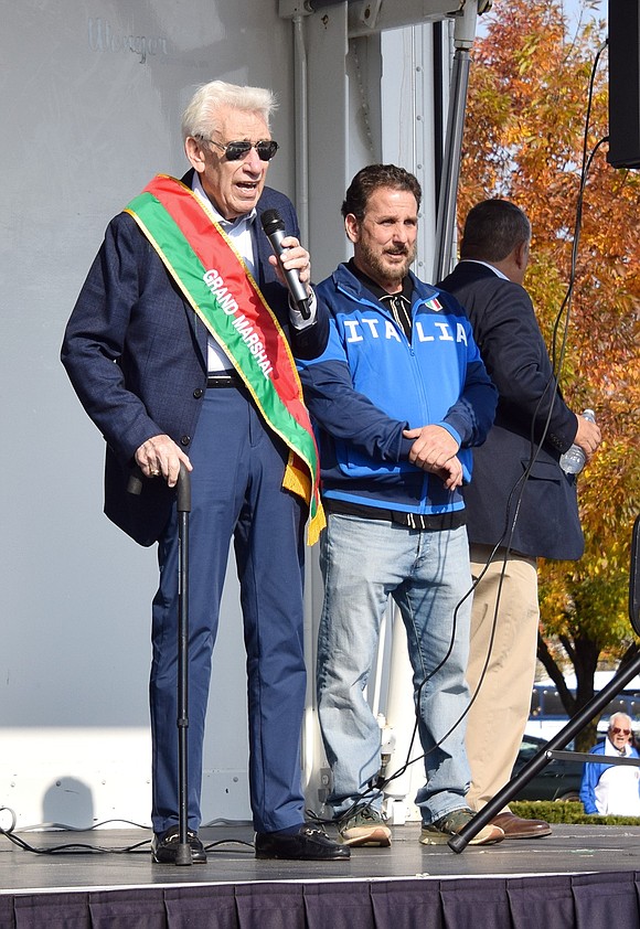 Parade Grand Marshal Anthony Napoli addresses attendees at the Italian Festival on Abendroth Avenue after the parade, which featured food vendors and musical performances by Caroline Del Juidice (not pictured).