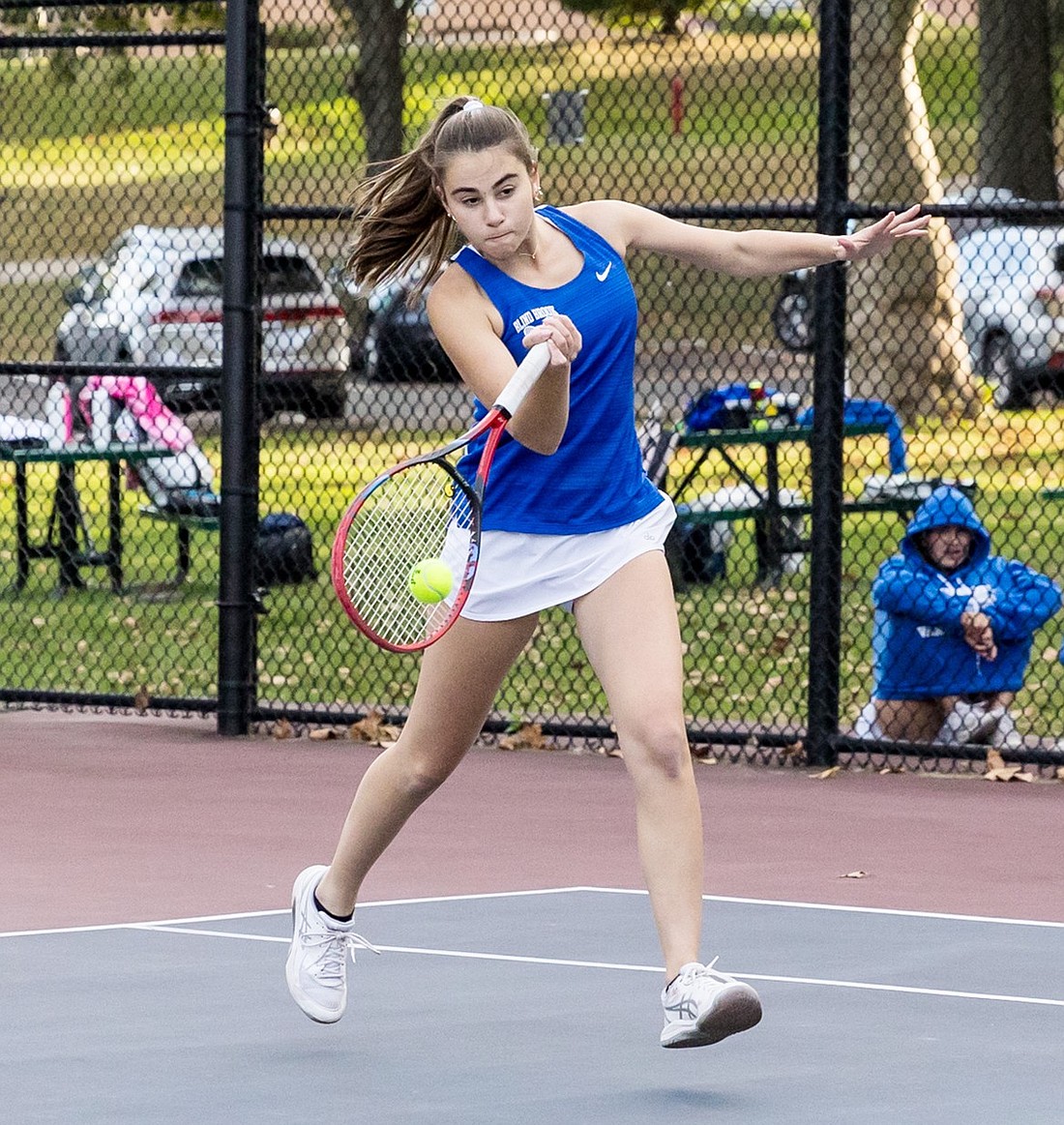 Senior captain Ella Mensch plays first singles for Blind Brook during a home tennis match against Edgemont on Tuesday, Oct. 8. The Trojans finished their regular season the next day as League Champions with a 10-0 record.