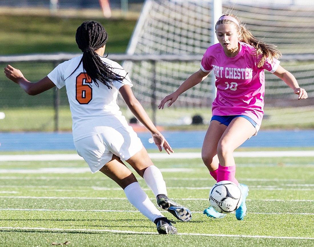 Sophomore Gianna Rende takes on a White Plains defender in Port Chester’s Thursday, Oct. 10 game against the Tigers. The Lady Rams were overpowered 4-0 in that home contest but have a respectable 7-7 record for the season.