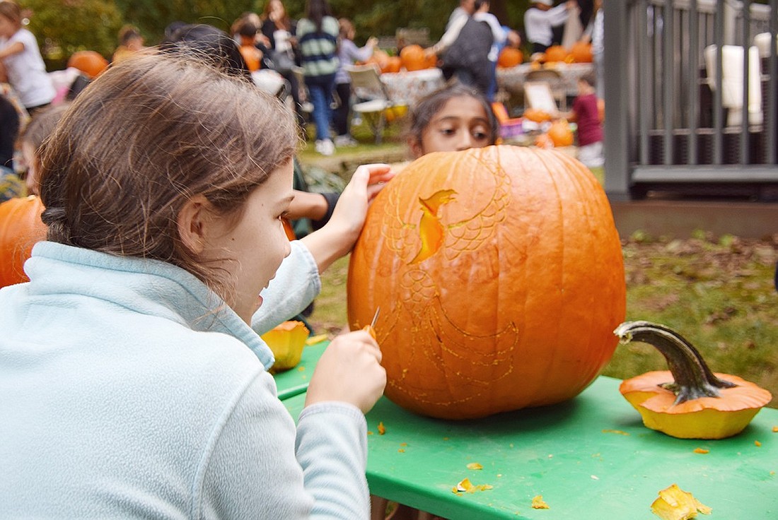 Casey Craighead, a 12-year-old resident of Sleepy Hollow Road, cuts a phoenix into her pumpkin during a Pumpkin Carving Party hosted by Ridge Street Elementary School teacher Jessica Yablow at her home on Crossway on Oct. 13. Craighead’s artwork was honored as the best overall by judges Oren and Paige Fery, Yablow’s children.