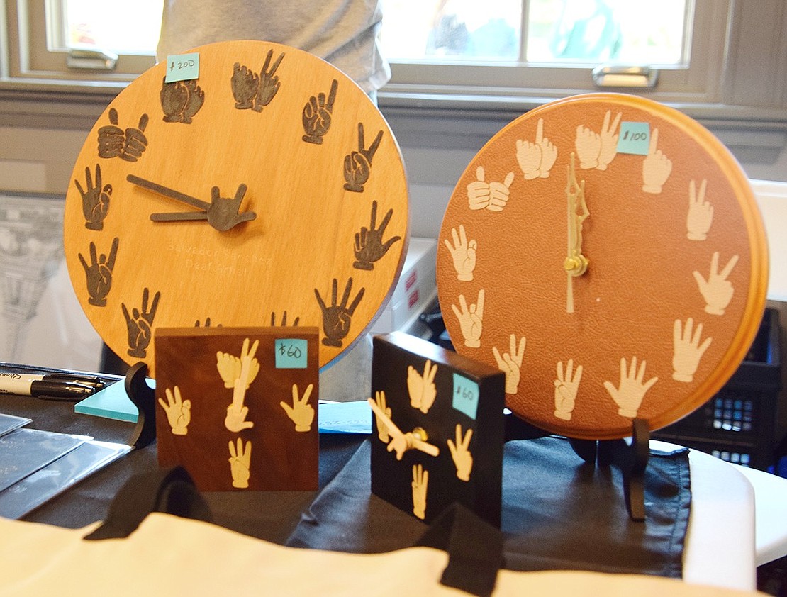 Salvador Sanchez, a deaf artist from New Rochelle, presented works inspired by American Sign Language, including clocks with the numbers swapped for images of their hand signs.