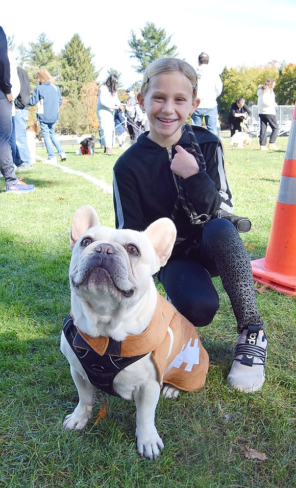 Dressed as a football, Rebel is ready to run a Hail Mary to win the contest. The 5-year-old French Bulldog poses with his owner Ella Sandarciero, a Ridge Street School second-grader, before the show.