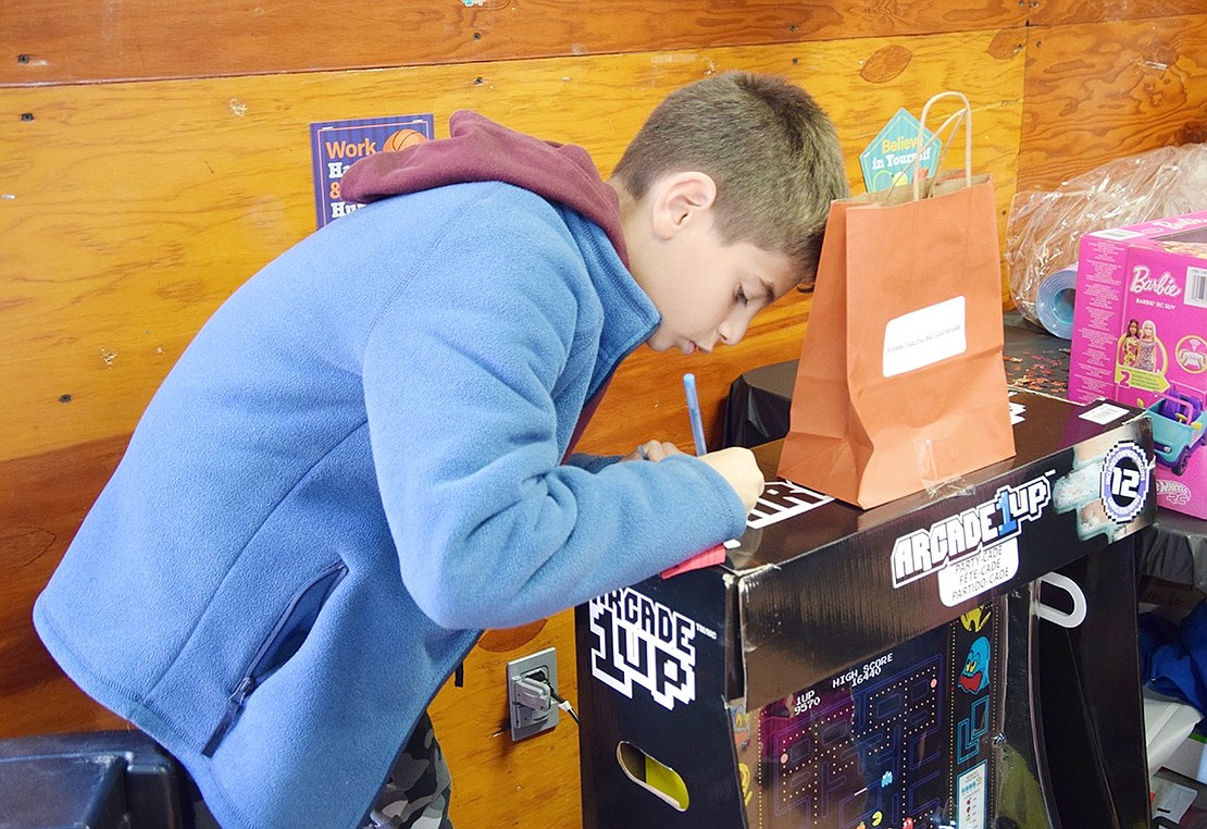 Blind Brook Middle School sixth-grader Anthony Gabrael enters the raffle for an arcade cabinet.