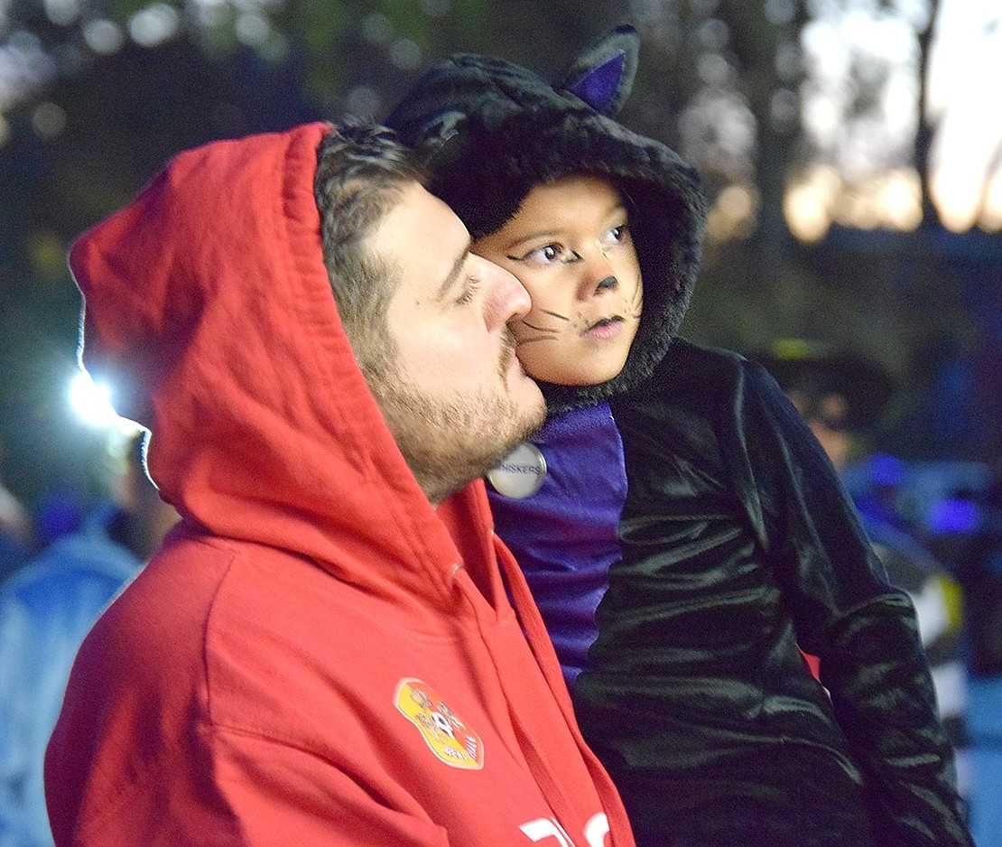 Port Chester resident Andrea Bucciarelli gives his 4-year-old daughter Victoria a kiss on the cheek as the event winds down.