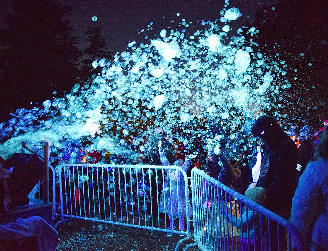 The always popular bubble bus lights up the park with neon foam while classic Halloween songs play.