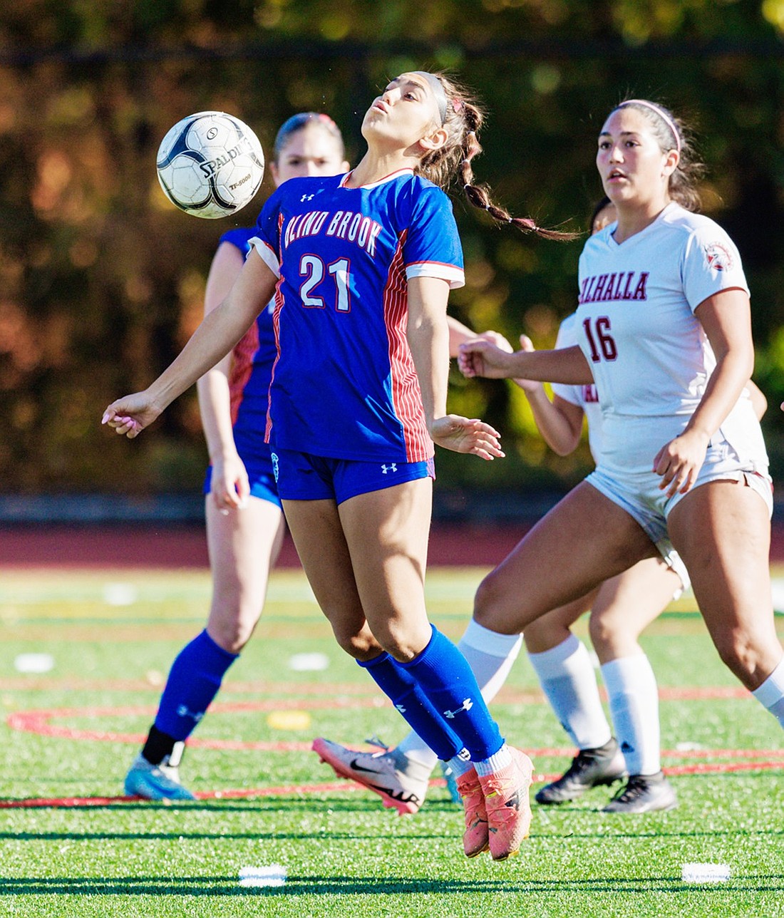 Sophomore striker Lola Gonzalez traps the ball with her chest in front of the Valhalla defense in Blind Brook’s first playoff game at home on Monday, Oct. 28. Gonzalez scored both goals in the Trojans’ 2-0 victory over the Vikings.