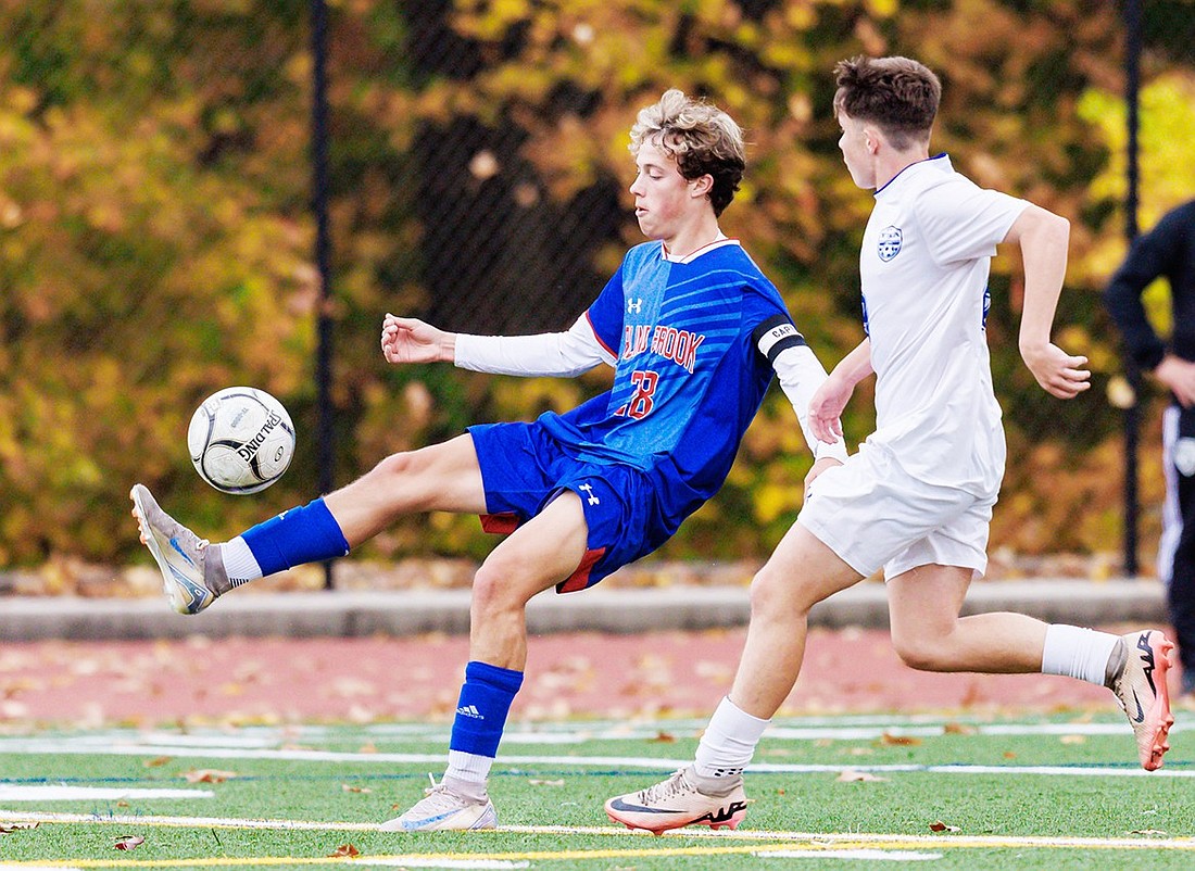 Captain Dylan McRedmond evades a Yonkers Montessori defender in Blind Brook’s Tuesday, Oct. 29 quarterfinal game at home. The Trojans ran away with that game 4-0, with Noah Brookman scoring three of those goals. McRedmond received All-League honors for his 2024 season performance.