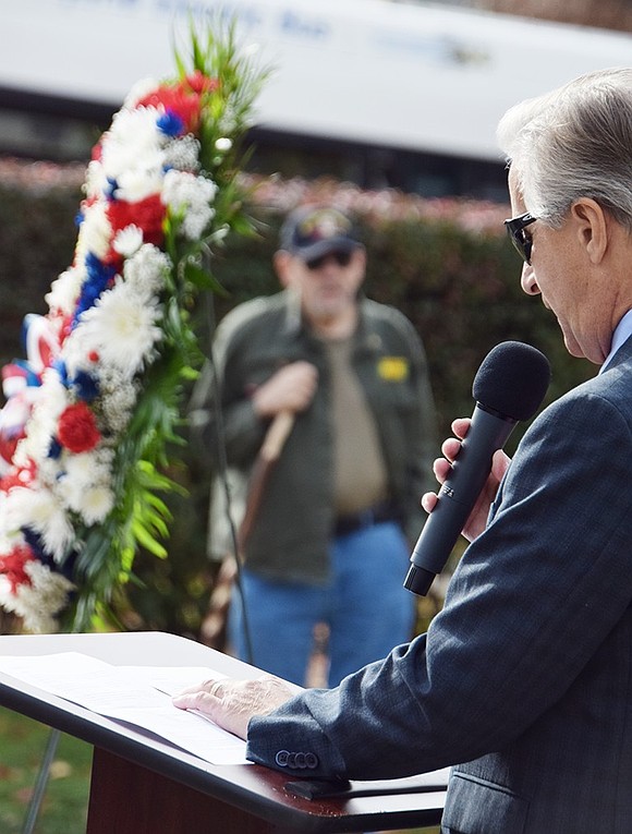 Deacon Mike Izzo of Quintard Drive gives the invocation at the annual Veterans Day ceremony in Port Chester’s Veterans’ Memorial Park on Sunday, Nov. 10 as Rye Brook Vietnam veteran Jerry Morano stands in the background.