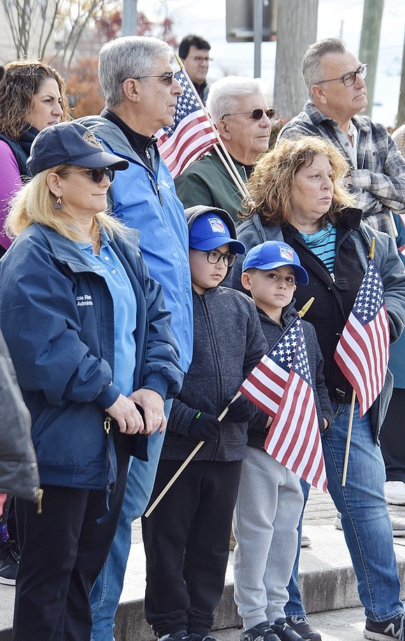 Rye Town Administrator Debbie Reisner (left), former Port Chester Trustee Dan Colangelo, his wife Josephine and grandchildren Liam Detlefs, 9, and Ryan Detlefs, 6, of W. Harrison, former Port Chester Mayor Richard “Fritz” Falanka and Rye Town Justice Max DiFabio were among the 50 people attending Sunday’s ceremony.