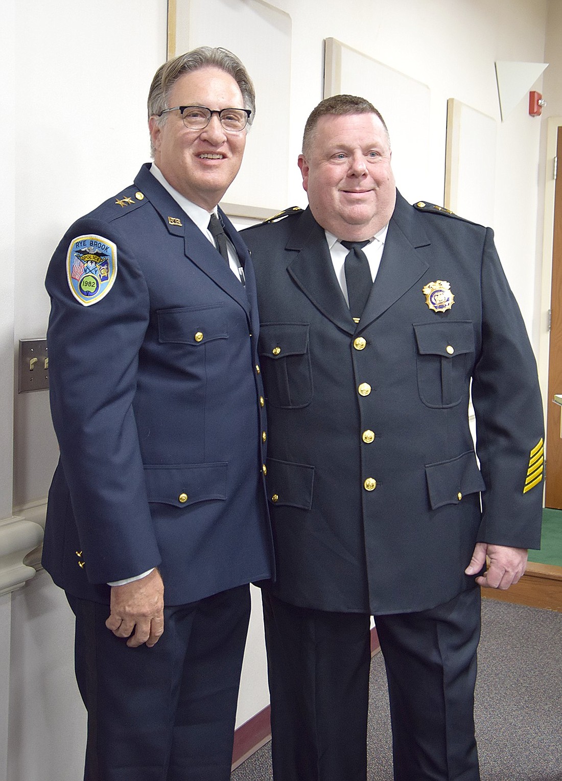 Outgoing Rye Brook Police Chief Greg Austin and his successor Eric Dengler pose for a photo after Dengler's swearing in ceremony on Tuesday, Nov. 12.