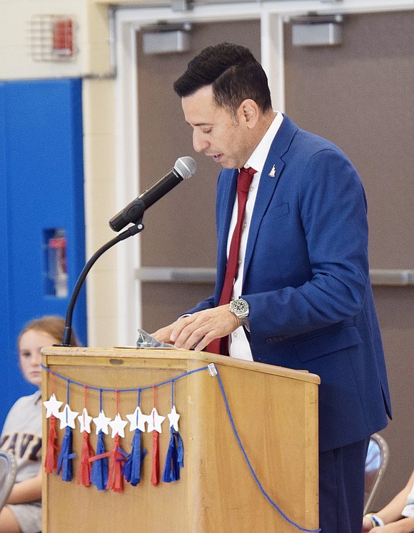 King Street School Principal Sam Ortiz conveys to his students the importance of honoring veterans for their service.