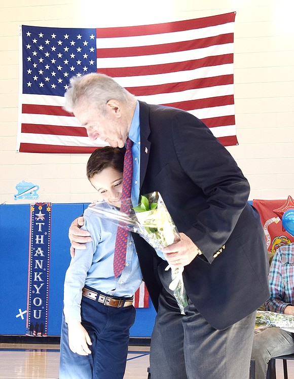 Luke Petriello, a 10-year-old fifth-grader at King Street School, leans into his great uncle Tom Duschan, a sergeant who served in the U.S. Army from 1962 to 1968.