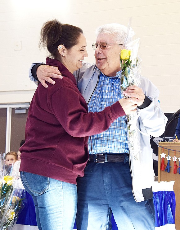 King Street School fourth-grade teacher Jessica Schwenk hugs her cousin Fritz Falanka, a former Port Chester mayor who served with the U.S. Army as a communications specialist from 1964 until 1970.