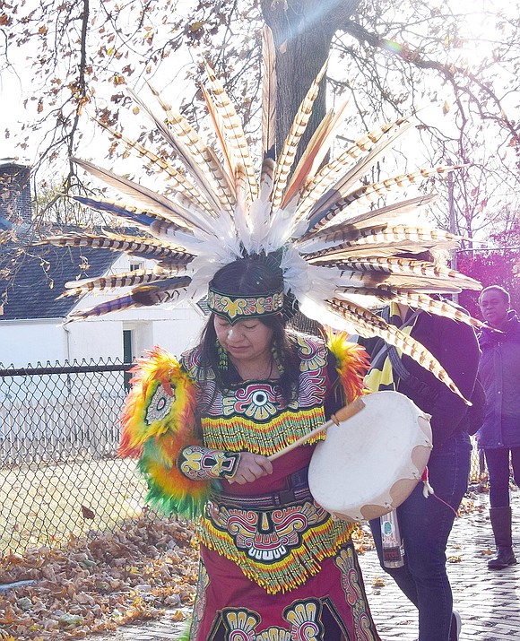 Marching to the beat of her drum, Martha Xochitl Blanca of Port Chester leads attendees out of the Bush-Lyon Homestead to the performance site in the park.