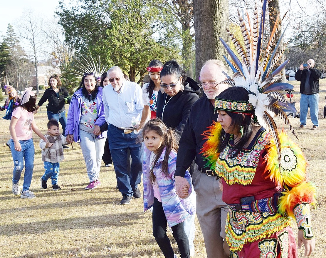 Port Chester resident Martha Xochitl Blanca (right) holds hands with St. Paul’s Church Pastor Jim O’Hanlon as she leads a friendship dance in Lyon Park at the third annual Celebration of Indigenous Cultures on Sunday, Nov. 17. The event, hosted by St. Paul’s Church, Congregation KTI and the Port Chester Historical Society, offered food, entertainment and games while educating attendees about native societies.