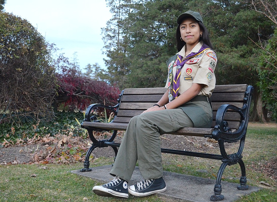 Ariana Ayala, a 15-year-old Port Chester resident, sits on a bench she cleaned and revamped as part of her Eagle Scout project on Tuesday, Nov. 19. She is the first of the community’s relatively new all-girl Troop 420 to reach the highest rank in Scouting.