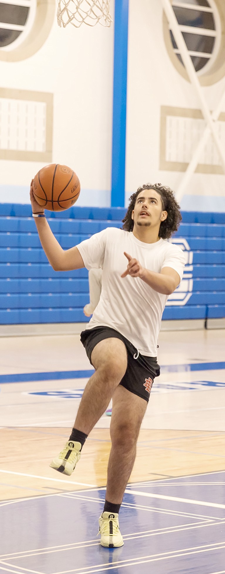 Junior Walquidi Valerio Sosa goes up for a layup during boys’ basketball practice last week in the Port Chester High School gym. He may be one of the starting five on the varsity team for the 2024-25 season.