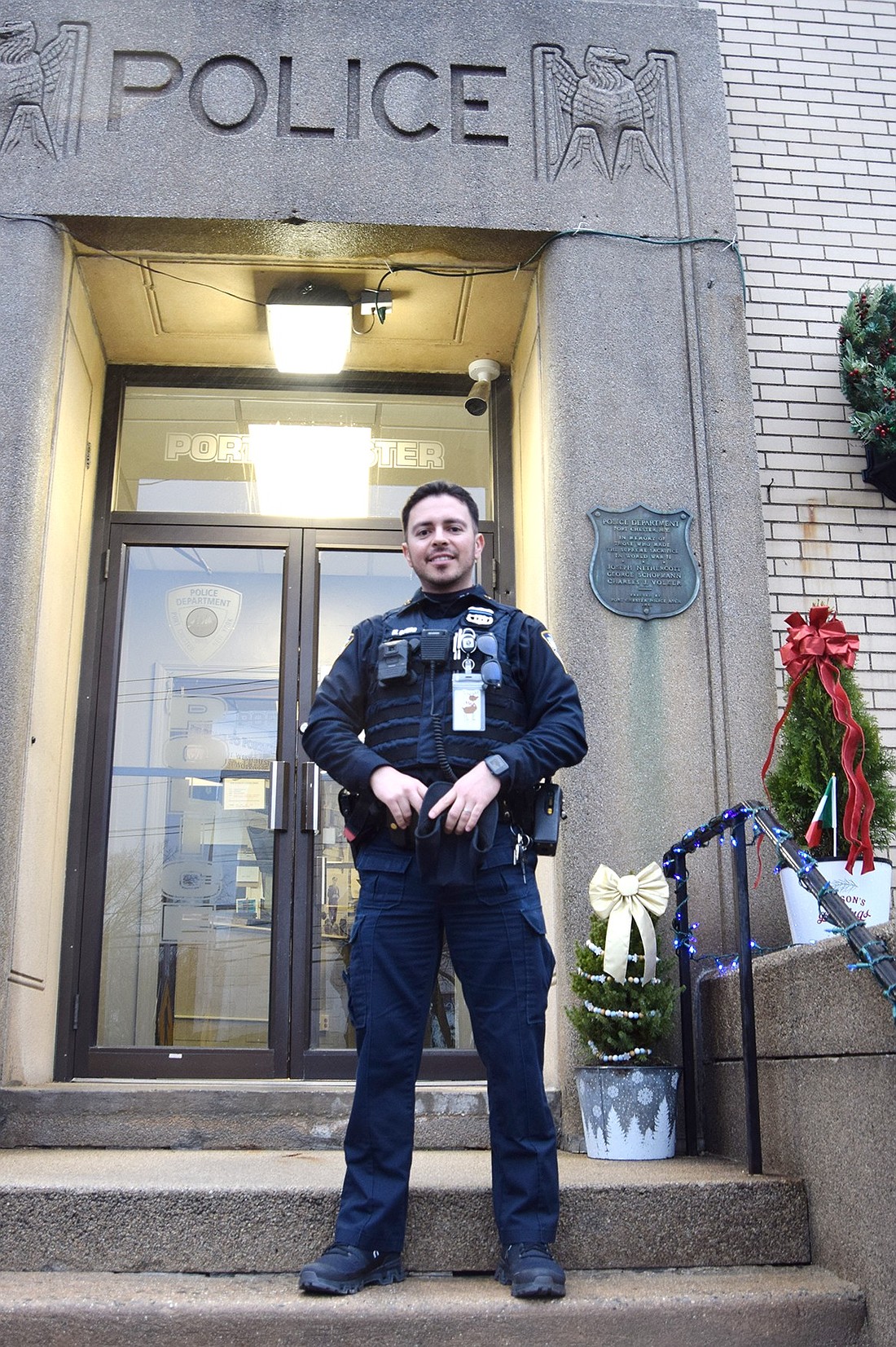 Two months on the job as a School Resource Officer overseeing the Port Chester School District elementary buildings, Moises Ochoa stands outside the Port Chester Police headquarters at 350 N. Main St. on Monday, Dec. 16, after discussing his motivation behind the role.