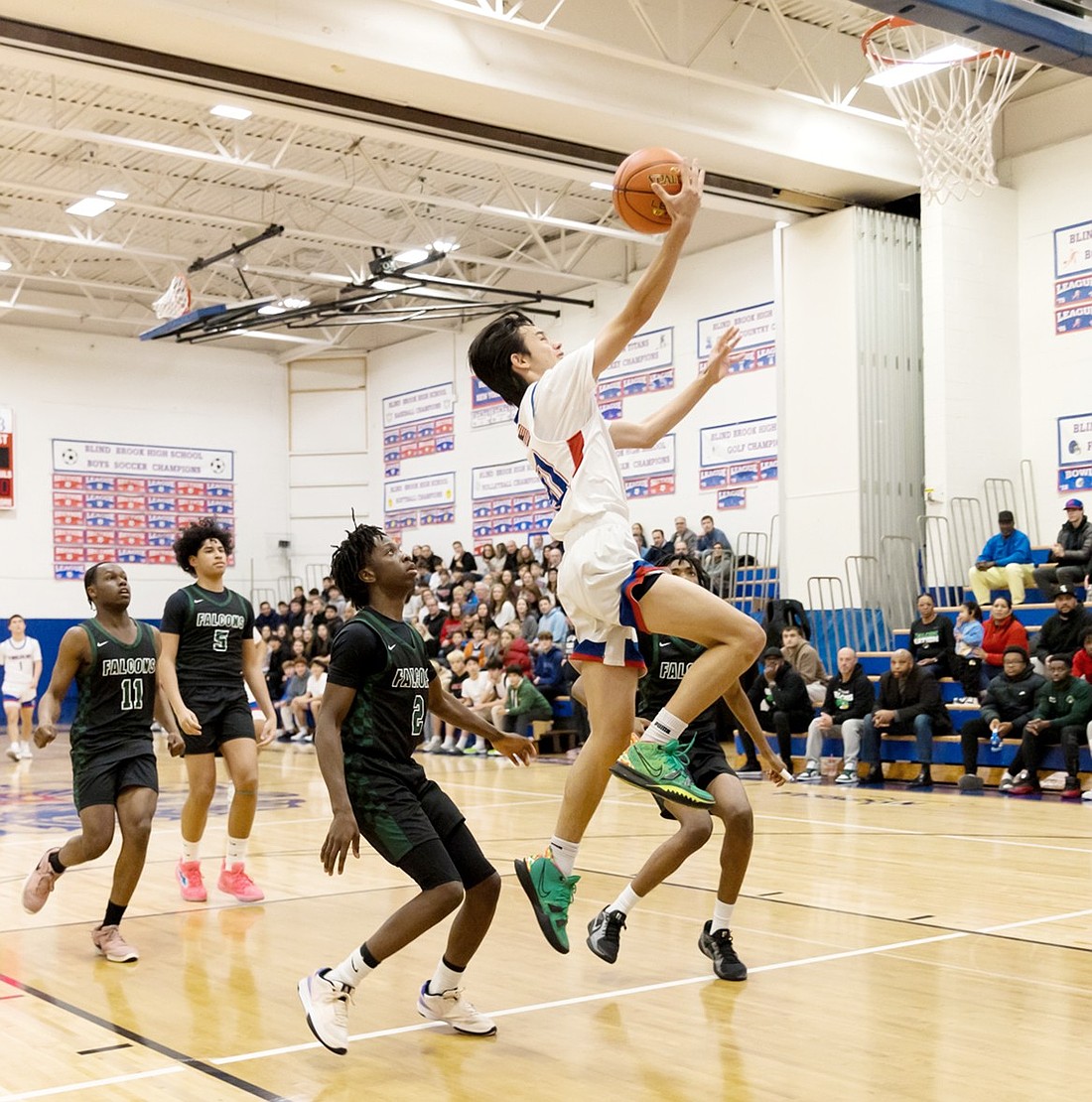 Junior Sebastian Lim does a transition layup in Blind Brook’s Friday, Dec. 13 exciting 48-46 home victory over a strong Woodlands team.