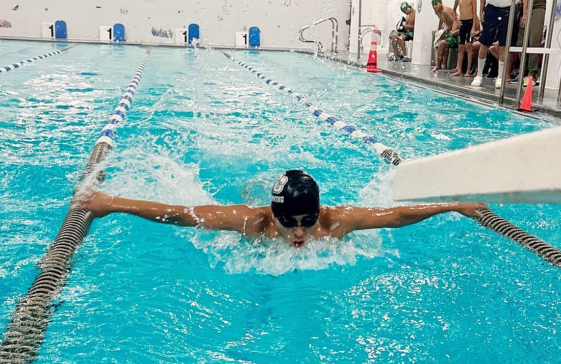 Senior Christian Yupangui competes in the 100-Yard Butterfly during Port Chester’s 51-38 home win over Woodlands on Tuesday, Dec. 10 at the Carver Center.