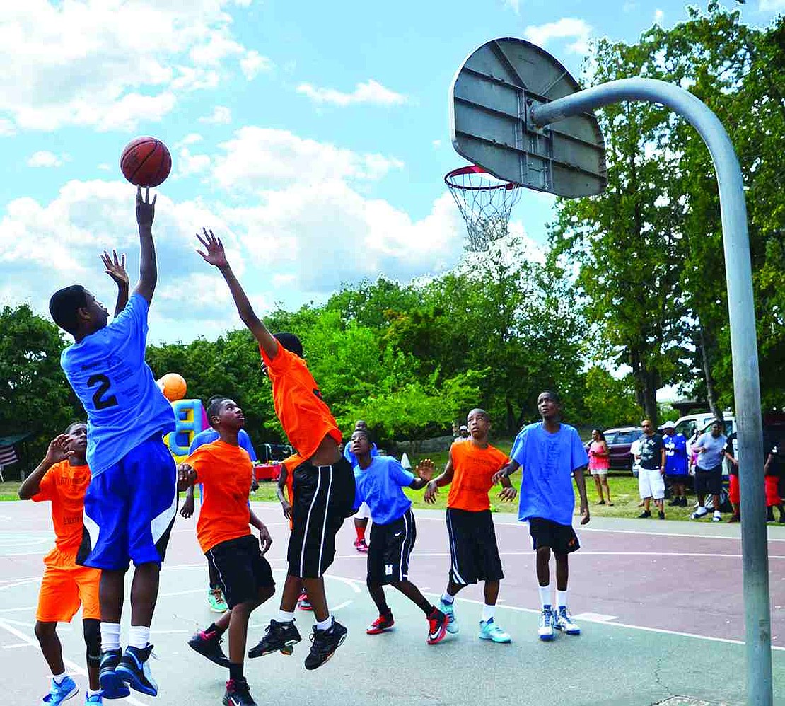 Wearing blue, Port Chester High School rising freshmen compete against students from White Plains High School. Port Chester ultimately won the game 58-48 at Unity Day at Columbus Park on Saturday, Aug. 9.