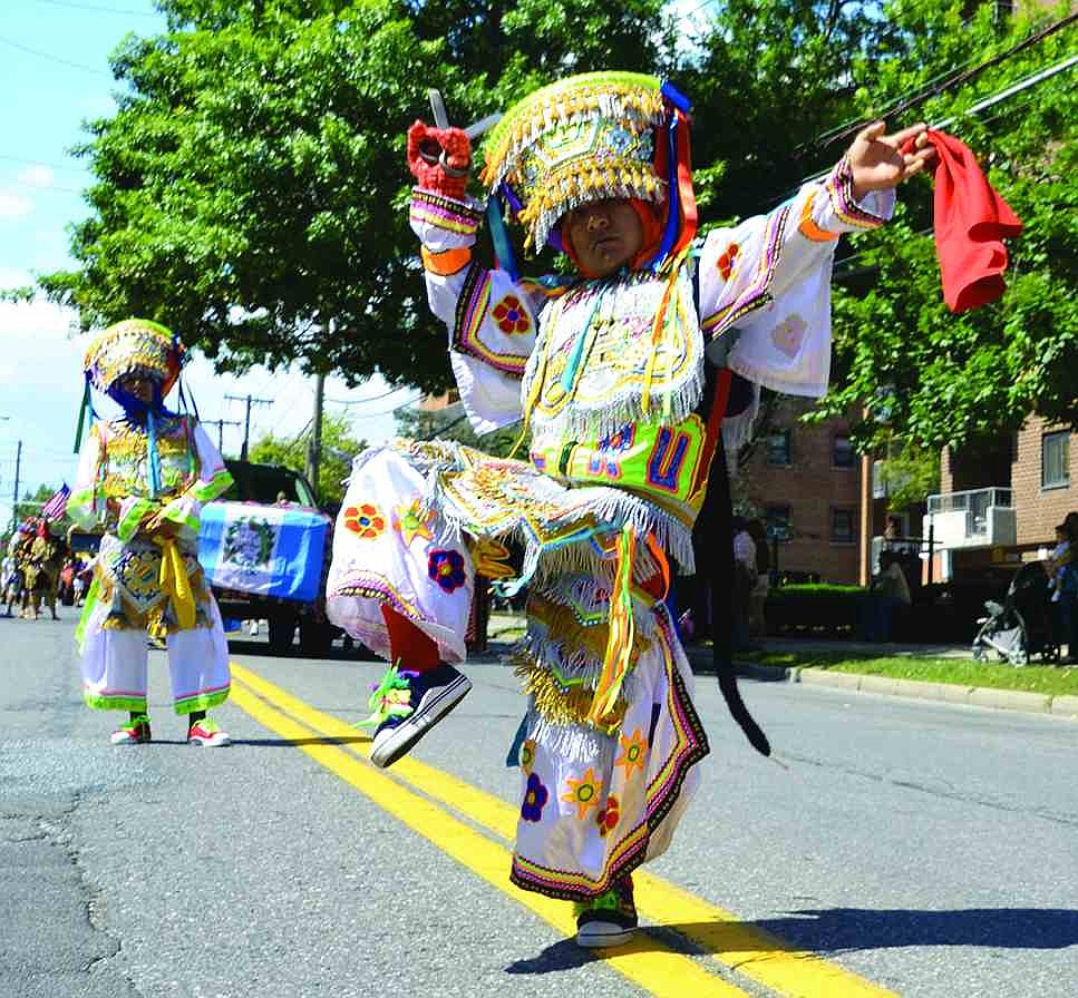 Walter Velille (right) of Port Chester performs the Peruvian scissor  dance with Luis Aguilar, who is also from Port Chester.  