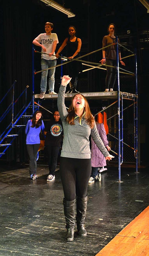  During a protest against plans to evict the homeless from a lot in order to build a cyber-arts studio, Maureen Johnson, played by senior Emmalie Tello, tells the crowd about a dream she had where a cow jumped over the moon. 