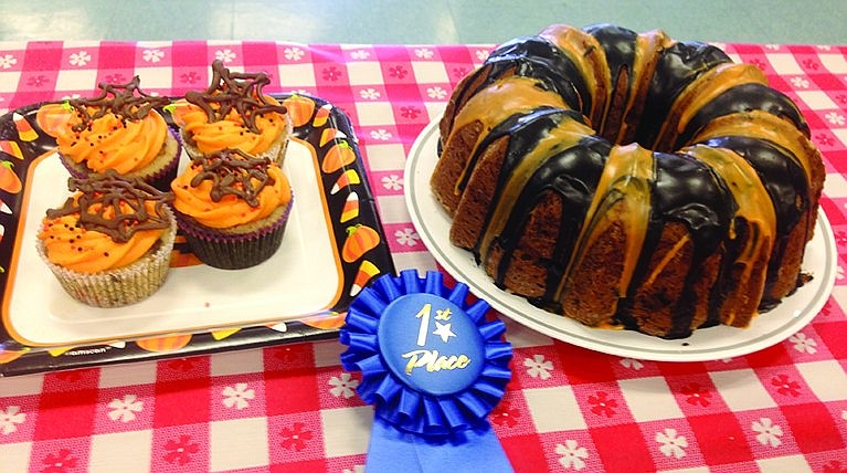 Veronica Johnston with her "creepcakes"-marble cupcakes-and Michael Srihari with his "spooky" apple cake tied for first place in the "fall festive" category in the bake-off.