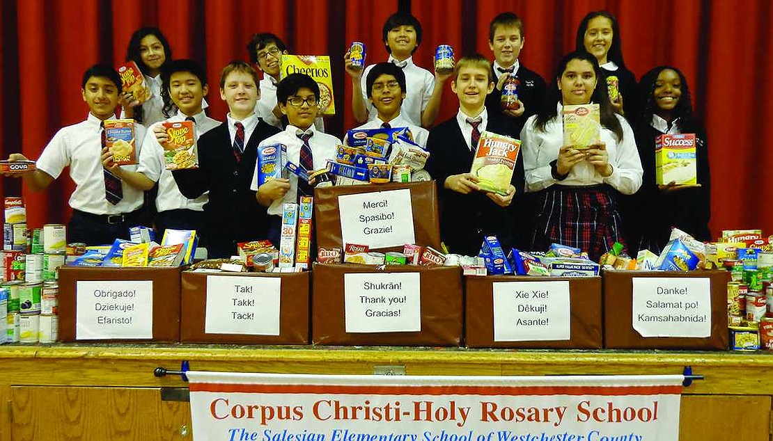  Students at Corpus Christi-Holy Rosary School in Port Chester organized a food drive during November and collected more than 20 boxes and 15 large bags of food to donate to Caritas, the food pantry associated with Holy Rosary Church, and local senior centers. Front row, from left: Joshua Oommen, Ken Kamiya, Connor Byrne, Silvestre Alarcon, Chris Paucar, Daniel Pokornicki, CarolinneMoura and Angelyce Gerrald. Back row, from left: Gabriella Buccieri, Kevin Orozco, Ethan Tieng, Michael Pokornicki and Nadeya DeDiago.