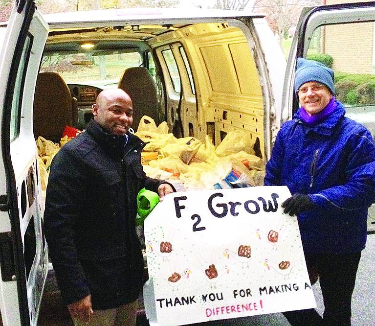  The Rotary Club of Port Chester and Rye Brook arranged a food drive at A&P Fresh in Rye Brook on Saturday, Nov. 22 to benefit the ongoing efforts of Food 2 Grow On to provide nutritional bags of food for Port Chester students to take home with them over the weekend. Seth Golden of Harrison and Michael Goldstein of Rye Brook unload their haul at All Souls Parish/Presbyterian Church on Parkway Drive. 