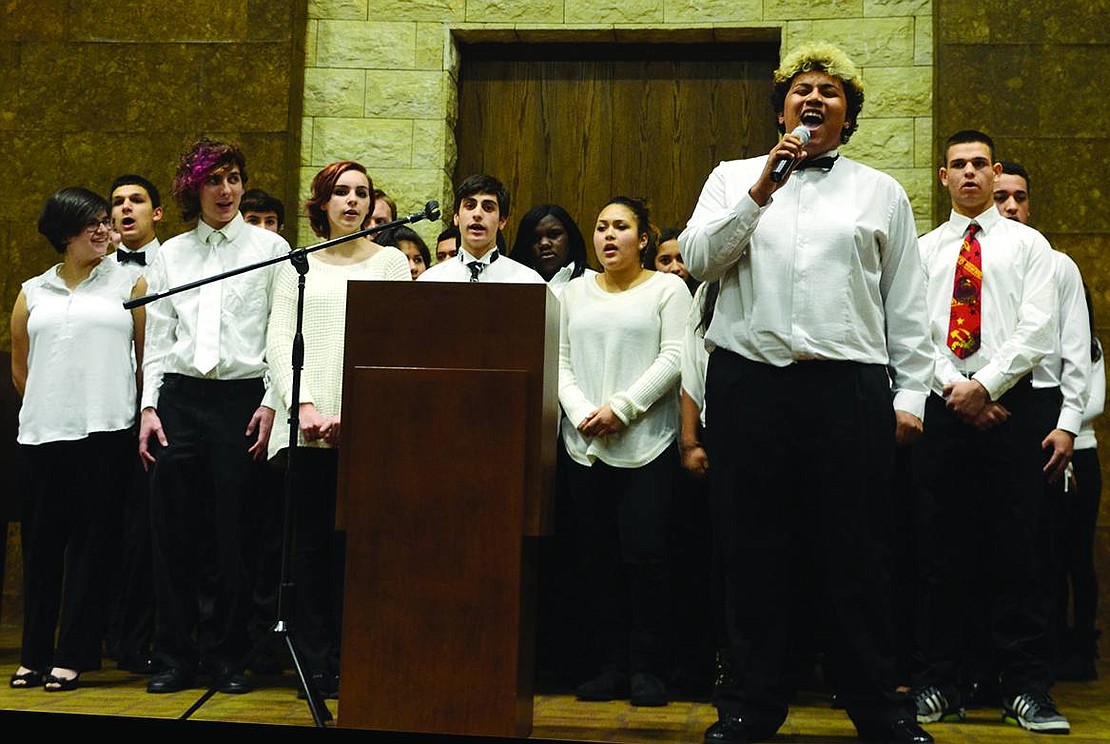 Port Chester High School junior Michael Bansey belts out "Ain't Gonna Let Nobody Turn Me Around" accompanied by the high school concert choir. 