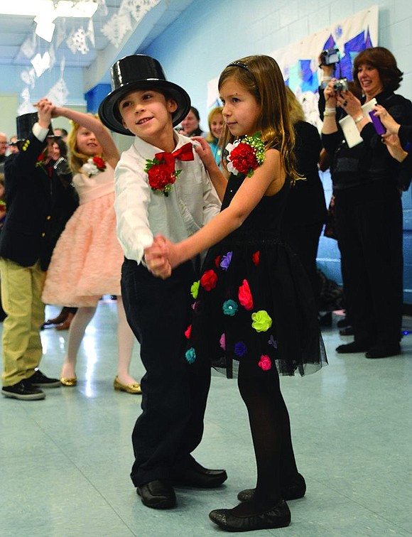 Partnered up, Noah Carelli and Abigail Coffey sway together at the 27th annual Snowball on Wednesday, Jan. 21 for the Ridge Street School first graders in Linda Greco's and Michelle Forzaglia's classes  