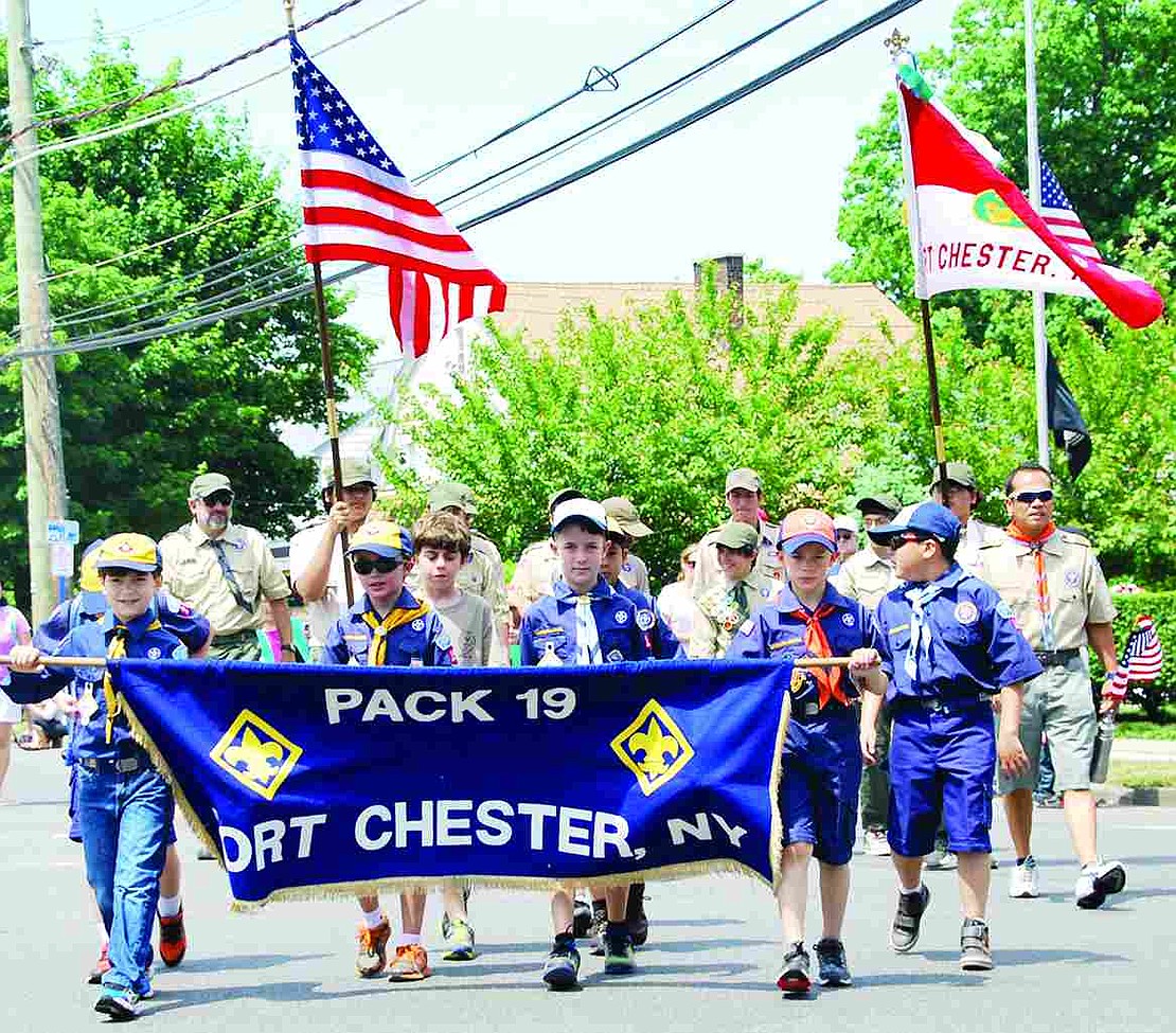 Port Chester Cub Scouts from Pack 19 start off the Memorial Day parade following a line of fire trucks and various elected officials. 