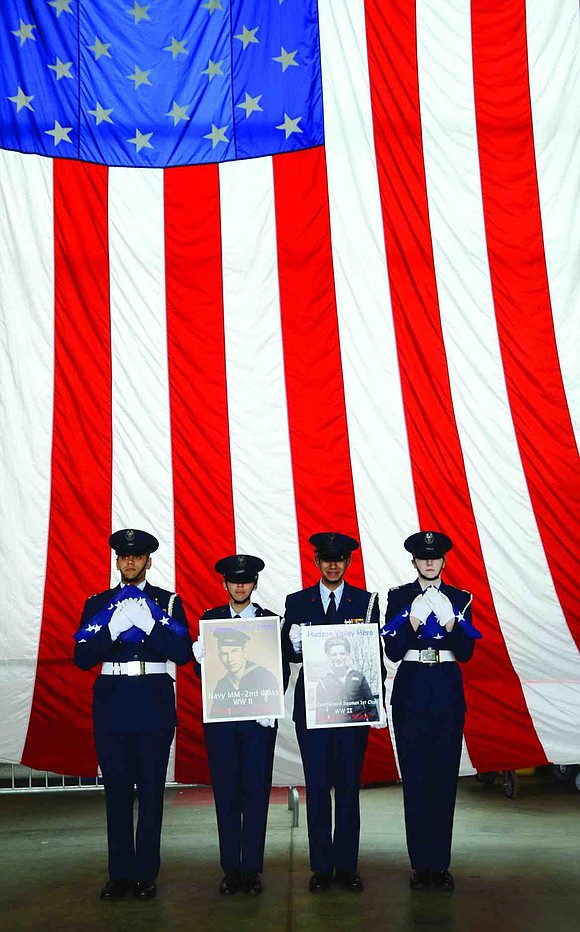  Two local veterans scheduled to go on a flight to Washington, D.C. to see the various war memorials on Saturday, May 9 were not able to make it, one due to illness and the other because he died. In their honor, pictures of them in uniform, as well as two flags flown over the United States Capitol, made the journey in their place. From left: Civil Air Patrol Cadet Lt. Col. Richard Ware, Cadet Capt. Lea Nora Ware, Cadet Chief Master Sgt. Michael Kali and Cadet Capt. Briana Ross. 