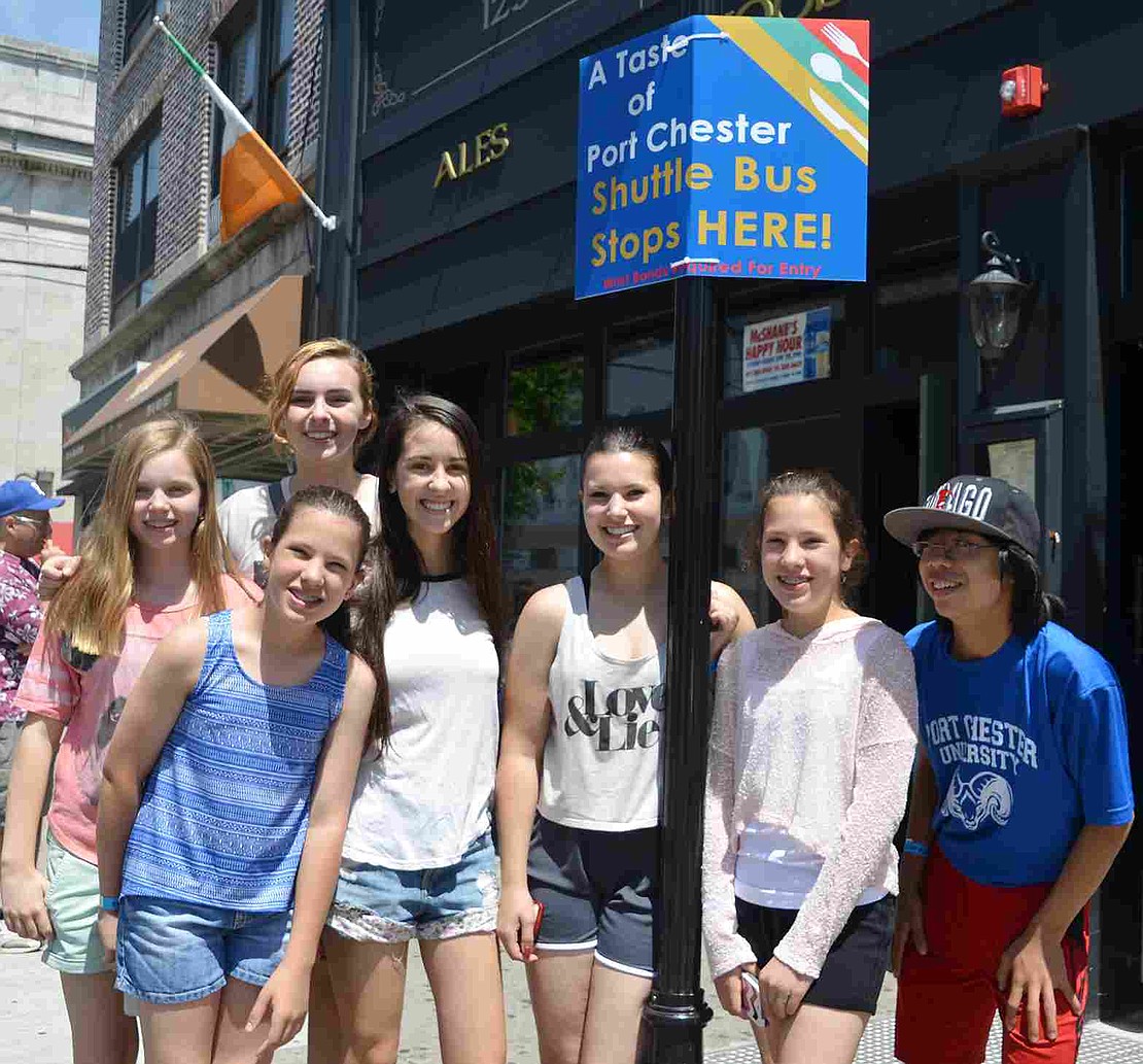  Local children wait for the shuttle bus to pick them up on Main Street in order to visit some of the other restaurants participating in Taste of Port Chester. From left: Molly Brakewood, Lyndsay Rosenfeld, Grace Simmons, Sofia Messerrly, Reanna Rosenfeld, Stacey Rosenfeld and Ari Johnson-Goodman. 