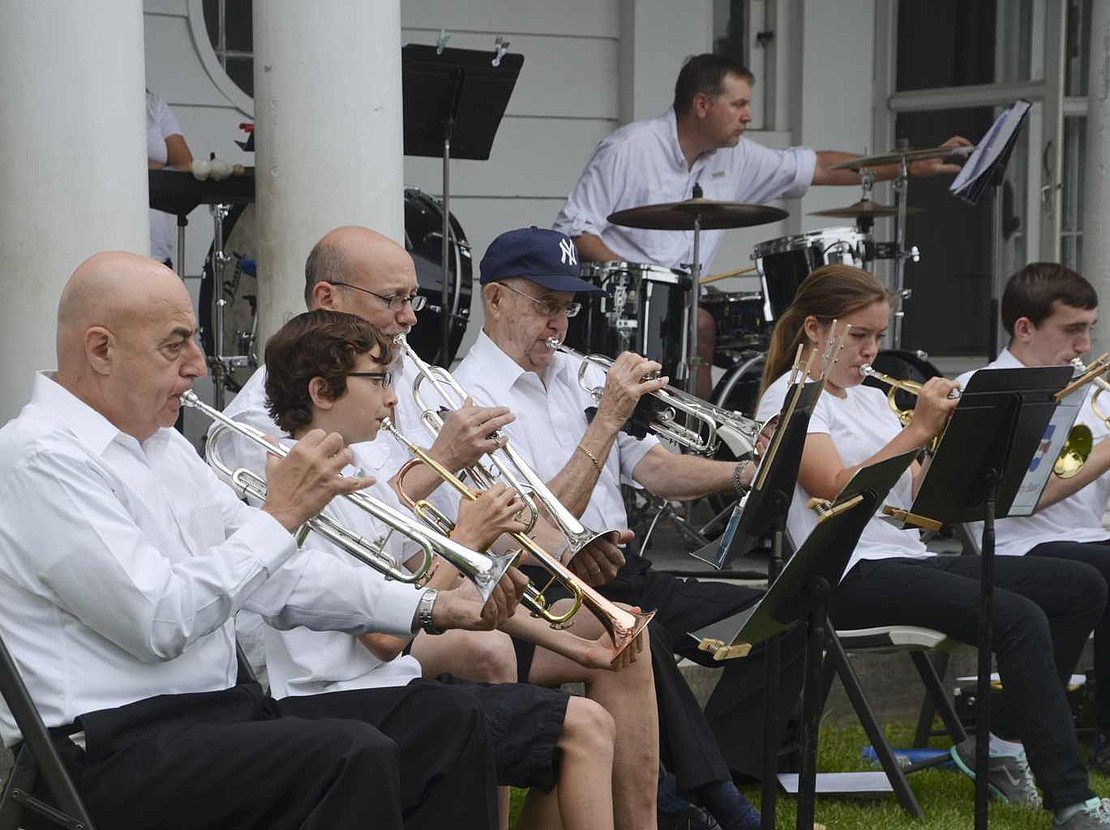 Members of the Rye Town Community Band play a rendition of "Yesterday" by John Lennon and Paul McCartney. 