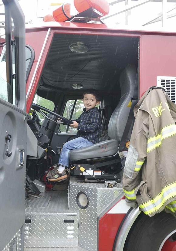 His feet may not be able to touch the floor, but that does not stop Rye Brook 4-year-old Ian Jimenez from trying to drive the Rye Brook fire truck. 
