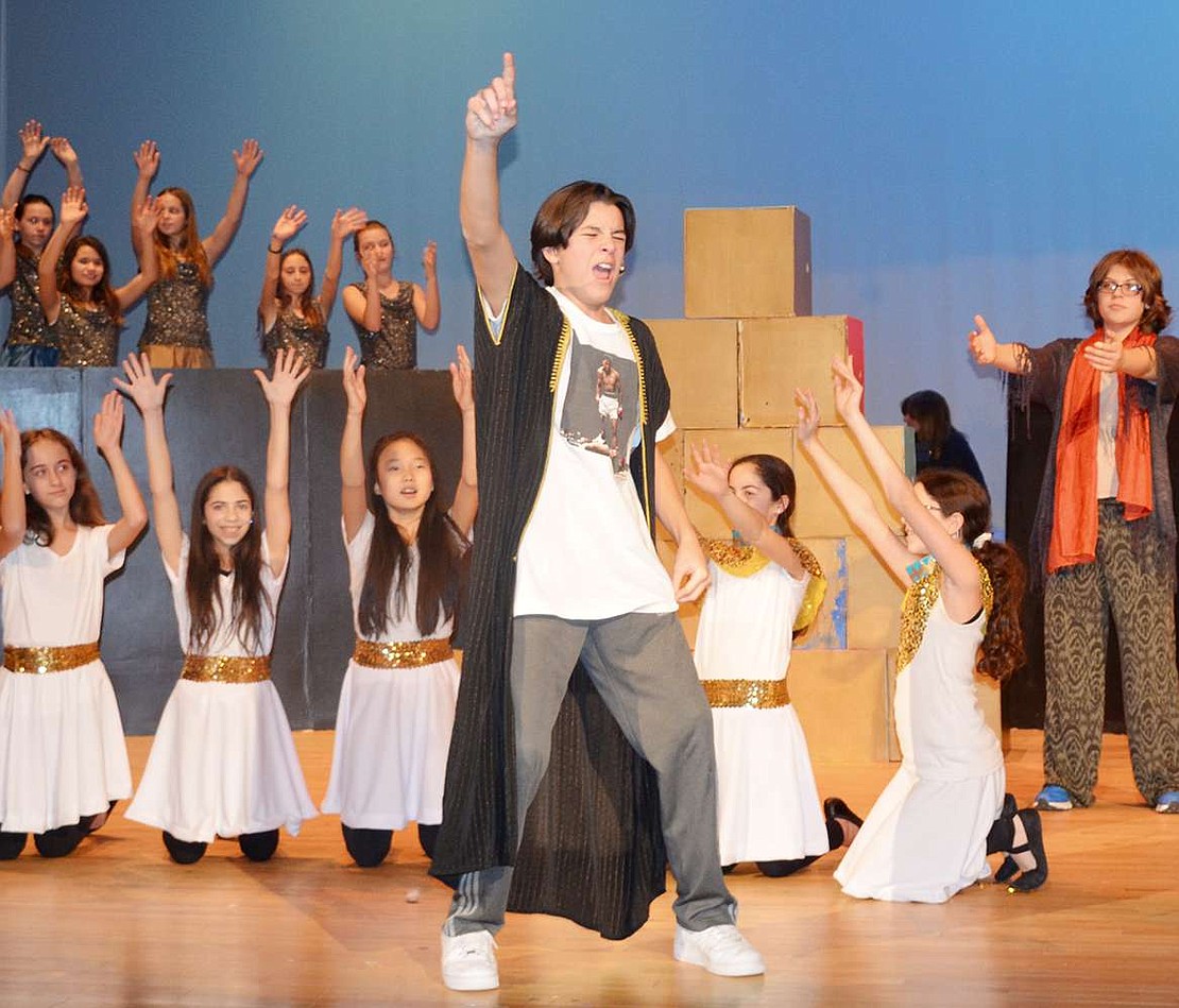  Flanked by cheering attendants, Pharoah, played by Blind Brook 8th grader Michael Lieberman, tells about a crazy dream he had.