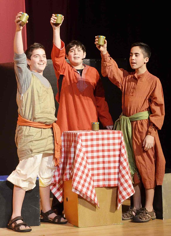  Joseph's brothers Asher, Levi and Zebulun, played by Blind Brook 8th graders Devin Weiss, Ethan Berman and Dean Moschitto, raise their glasses in memory of days gone by. 