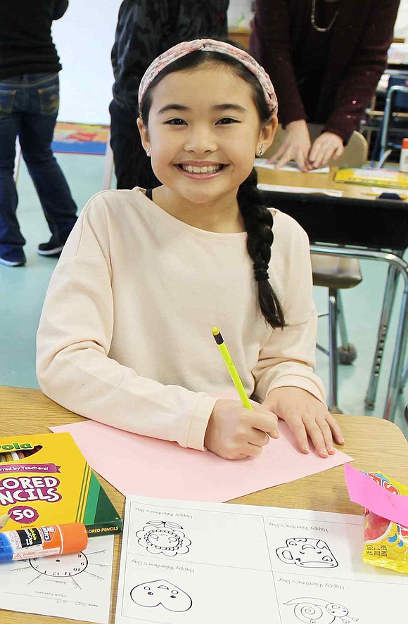  Kyra Mak starts to create a Valentine's Day card. 