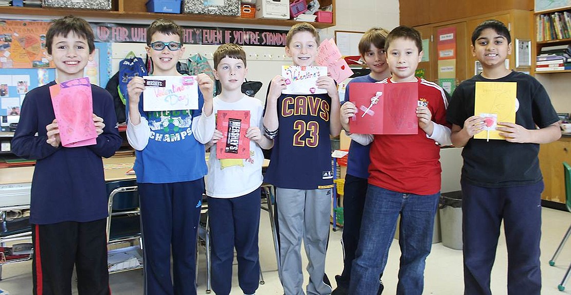  Blind Brook fourth graders from Christine Onofrio's class show off the cards they created for homeless children.