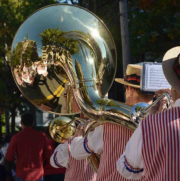 Reflected in the sousaphone, The Dixie Dandies perform in the 109th Port Chester-Rye Brook Columbus Day Parade on Sunday, Oct. 11. 