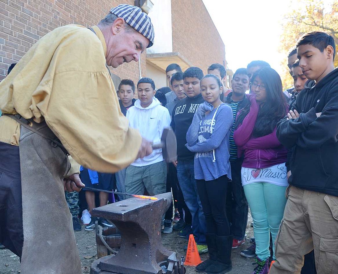  Bill Fitzgerald, a professional blacksmith, shows how iron products were made during the Civil War. Friday, Oct. 23 was an activities-filled Civil War Day for Port Chester Middle School 8th graders as a way to bring the social studies curriculum to life. 