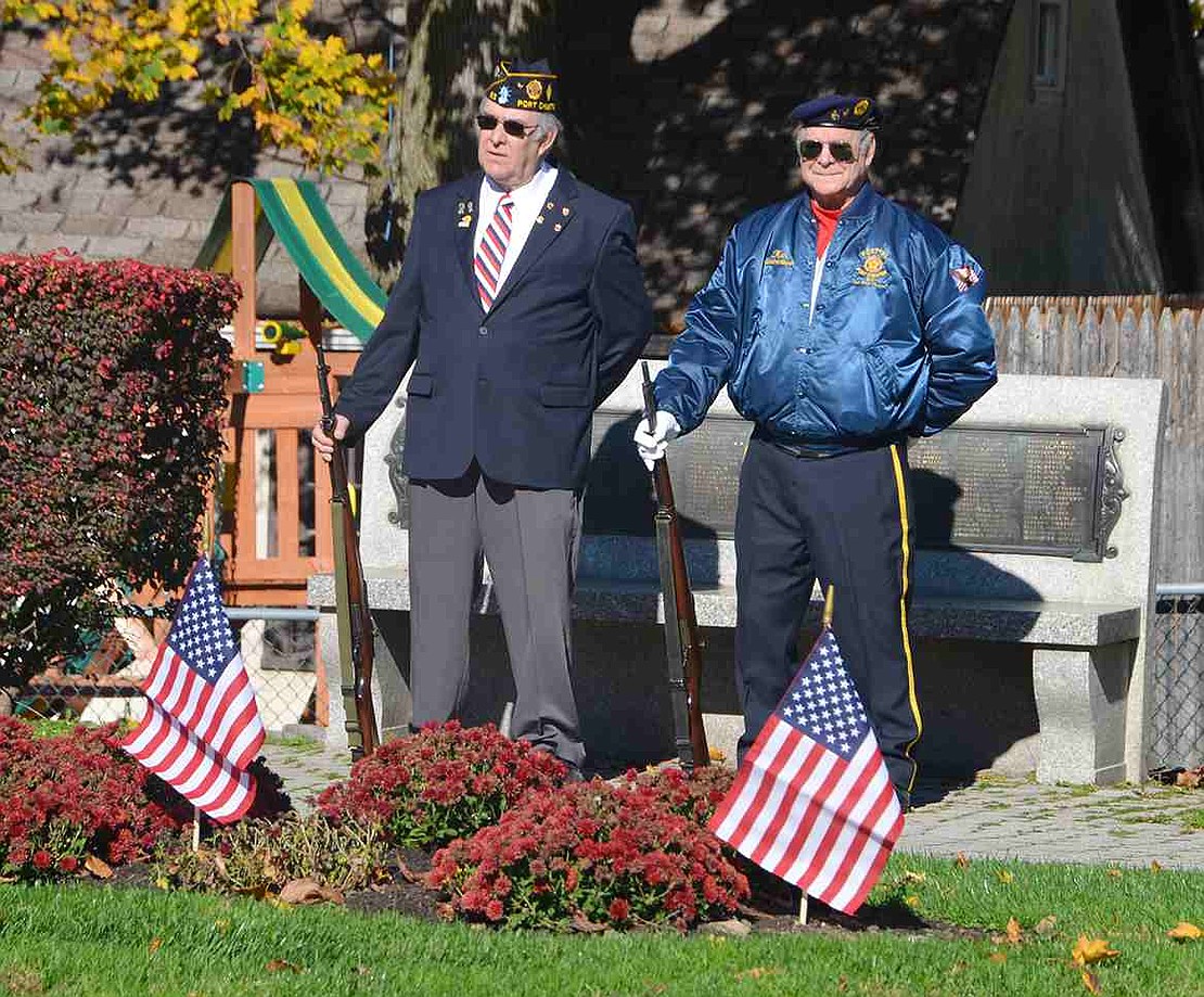  Port Chester American Legion Firing Squad members Bill Chiapetta and Kenny Neilsen stand at attention. 