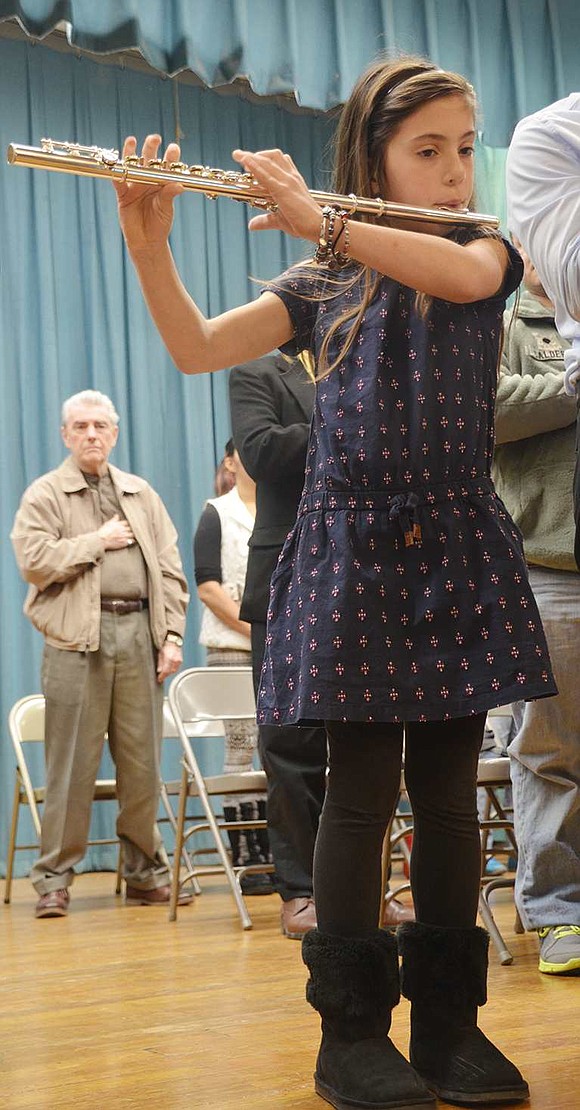  King Street School fifth grader Sophia Tsoukalas plays "The Star-Spangled Banner." The King Street School Veterans Day ceremony took place on Tuesday morning, Nov. 10. 