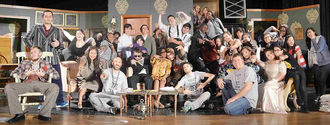 The cast and crew from the Port Chester High School drama club's production of You Can't Take It with You gather on stage. 