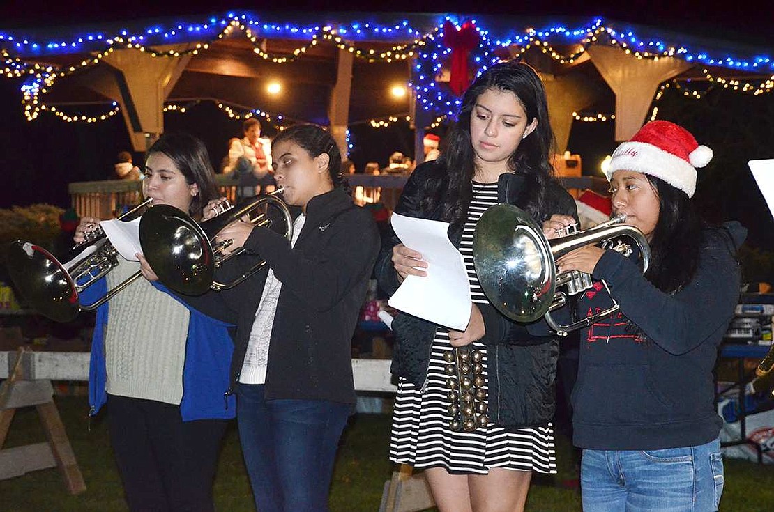  The Port Chester High School Brass Ensemble entertains with holiday tunes. 