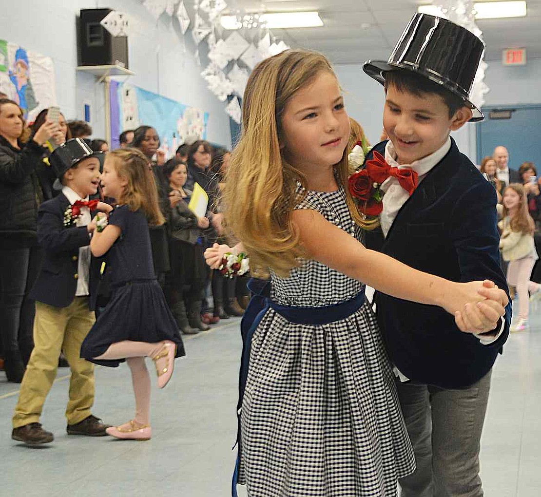 Partnered up, Skylar Sommers and Oliver Caspi from Linda Greco's class waltz to "Winter Wonderland." The Ridge Street School first graders danced up a snowstorm at the 28th annual Snowball on Friday, Jan. 22 for the students in Linda Greco's and Keri Fischer's classes. Another Snowball for the other first grade classes took place the day before. 